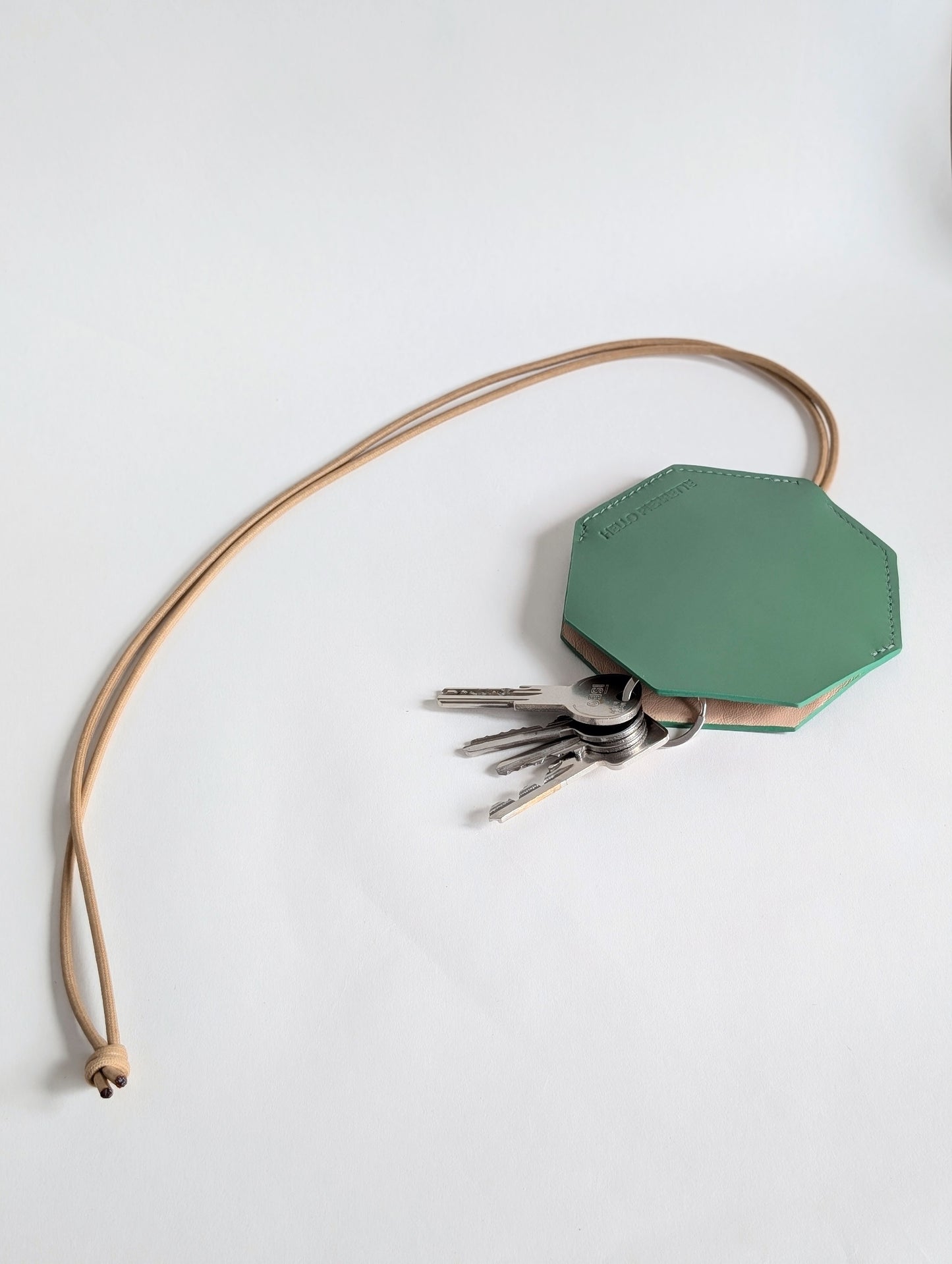 Octogone green key holder made of high-quality, durable leather with a stylish design. Perfect for keeping keys handy.